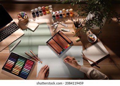 Artist drawing with pastel pencil at table, top view - Powered by Shutterstock