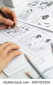 The artist draws anime comics on paper. Storyboard for the cartoon. The illustrator creates sketches for the book. - Shutterstock ID 2047451924