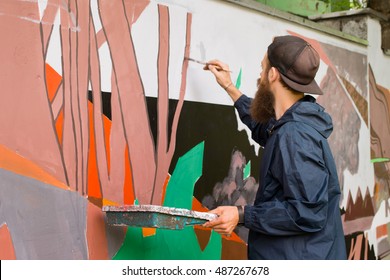 The Artist Draws Graffiti.