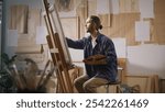 An Artist Draws in His Studio to Relieve Stress and Enhance Mental Well-Being. Highlights the Importance of Art in Emotional Self-Regulation and the Role of Creativity in Stress Reduction Health.