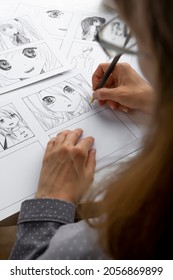 An artist draws a storyboard of an anime comics book. Manga style. - Shutterstock ID 2056869899