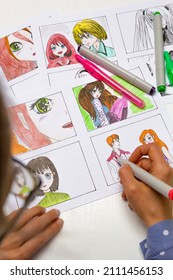An artist draws a storyboard of an anime comics book. Manga style. The designer animator draws with a watercolor brush with a pen the characters of a color sketch of the cartoon. - Shutterstock ID 2111456153