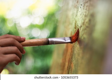 Artist hand with brush painting 