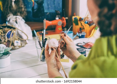 The Artist Making A New Doll Face At The Toy Factory.  The Master Artist Processes The Doll's Head. Close-up