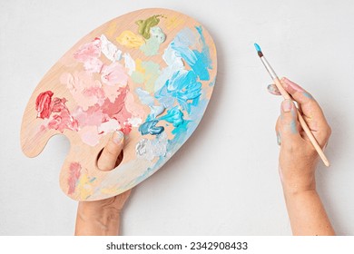 Artist painting palette with brushes. Craft hobby background. Recomforting, destressing hobby, art therapy - Powered by Shutterstock