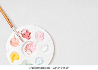 Artist painting palette with brushes. Craft hobby background. Recomforting, destressing hobby, art therapy