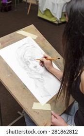 The Artist With A Pencil, Drawing A Portrait.