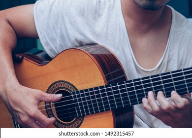 Artist Playing Acoustic Guitar.happy Man Sitting Enjoy Relax Time.concept For Art And Music Therapy For Relaxation And Healing For People