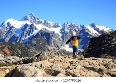 Artist Point, Washington State-USA - October 14, 2018 : Cute little boy walking on the rocks in the background of Mt Shuksan, Mt Baker-Snoqualmie National Forest. - Shutterstock ID 1274795026