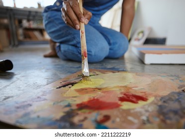 Artist Woman, Painting And Paint Brush On Art Studio Floor Being Creative And Working With Watercolor For Artwork Project. Talented, Skill And Canvas Closeup With Hand Of A Female Painter In Workshop