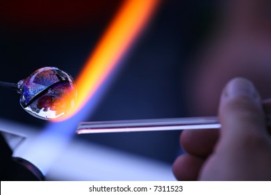 Artist works on glass