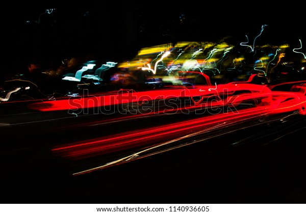Artistic abstract\
wallpaper background of long exposure of light trails of vehicles\
in a motorway. No\
people.