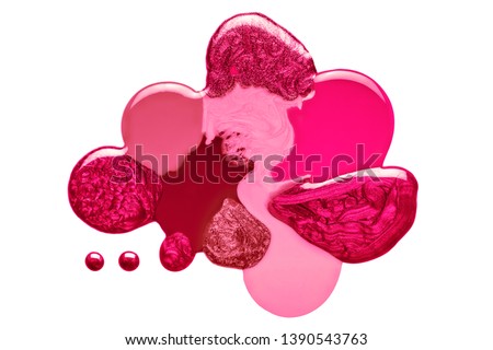 Artistic blend of different shades of pink and crimson nail polish in fused blobs giving an abstract globular form isolated on white in a fashion and beauty concept. Top view abstract design