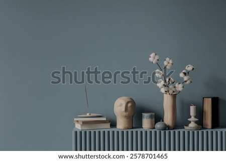 An artistic composition of soft blue bedding paired with complementary decor items, highlighting the textures and layers of a serene bedroom.