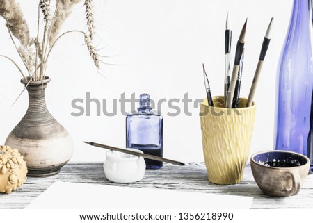 Artistic concept. Mockup with space for text. On the table are accessories for creativity from natural materials, clay and wood. Copy space