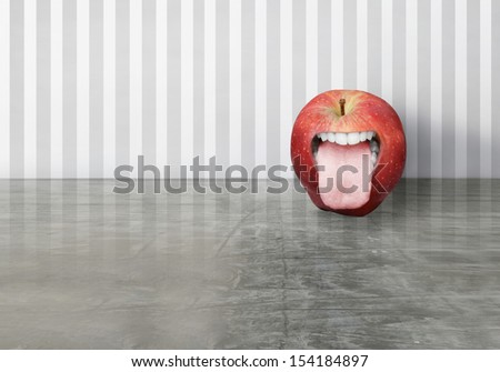 Artistic creation of a red apple with an opened human mouth that sticking out his toungue