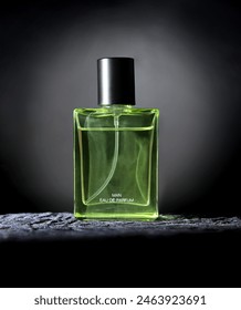 Artistic and creative product photo of clean transparent green perfume bottle, with some textured background, 