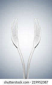 Artistic Cup Of Wine Form Or Hands Form Made With Two Forks Isolated On Radial Gradiant Background