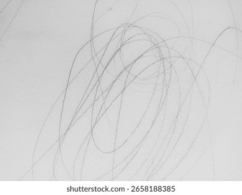 Artistic Expression in Scribbles, This image showcases a series of abstract free-flowing pencil lines on a blank surface.