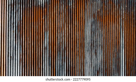 Artistic of old and rusty zinc sheet wall. Vintage style metal sheet roof texture. Pattern of old metal sheet. Rusting metal or siding. Corrosion of galvanized. Background and texture in retro concept - Shutterstock ID 2227779095