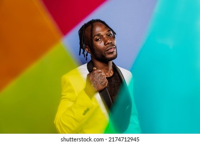 Artistic Portrait With Gel Lights. Handsome Man Posing On Colored Backgrounds