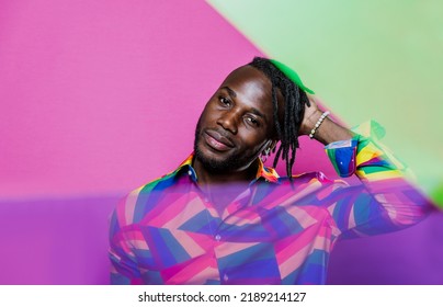 Artistic Portrait With Gel Lights. Handsome Man Posing On Colored Backgrounds