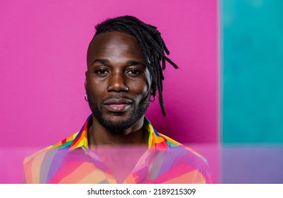 Artistic Portrait With Gel Lights. Handsome Man Posing On Colored Backgrounds