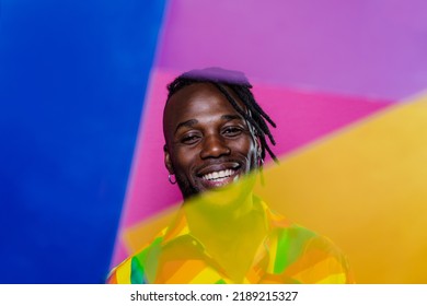 Artistic Portrait With Gel Lights. Handsome Man Posing On Colored Backgrounds