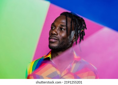 Artistic Portrait With Gel Lights. Handsome Man Posing On Colored Backgrounds