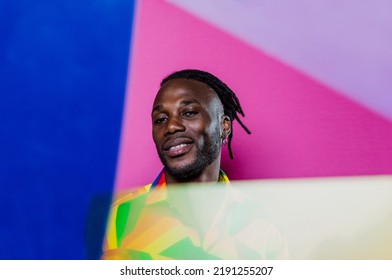 Artistic Portrait With Gel Lights. Handsome Man Posing On Colored Backgrounds