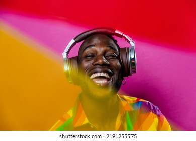 Artistic Portrait With Gel Lights. Handsome Man Posing On Colored Backgrounds