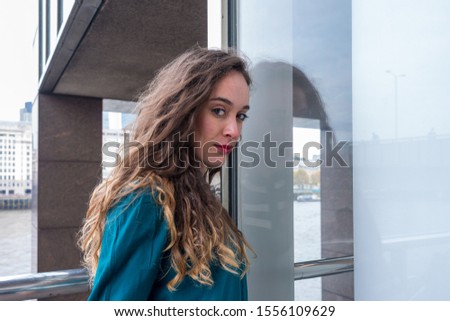 Similar – Beautiful young woman against a mirror wall