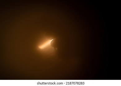 Artistic Portrait Of The Silhouette Of A Bearded Man's Face Against Warm Light