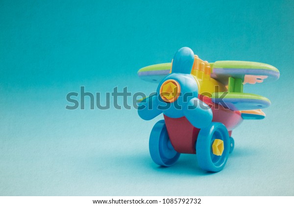 Artistic toys model plane, Airplane colorful\
model on blue background\
grunge.