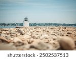 An artistic view of the lighthouse at the end of the dock in Salem, Massachusetts.