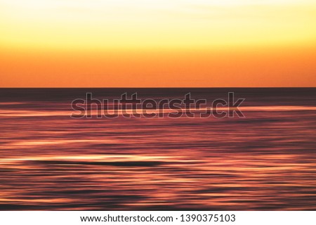 Artistic view of ocean sea water in long exposure in motion - background and coulours for nature concept - outdoors holiday vacation