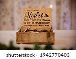 Artistic wooden wedding sign in