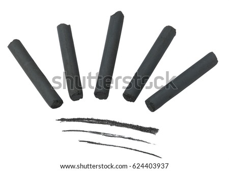 Artist's black charcoal for drawing isolated on white background .