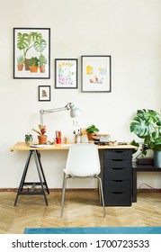 Artist's workplace for working from home with watercolor paints, brushes and sketchbooks. Place for design, illustration and creativity. 