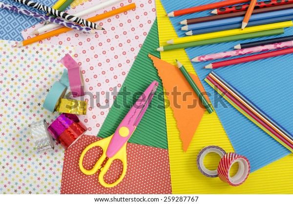 Arts and craft supplies. Color paper,\
pencils, different washi tapes, craft\
scissors.