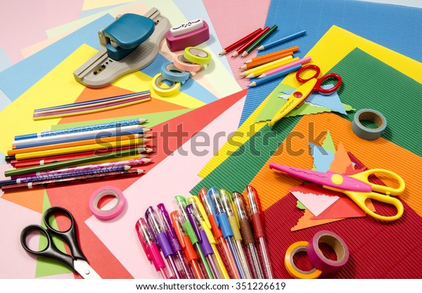 Arts and craft supplies.\
Corrugated color paper, pencils, different washi tapes, craft\
scissors.