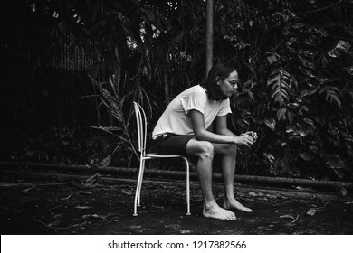 Artsy Man Relaxing In The Heat Outdoors