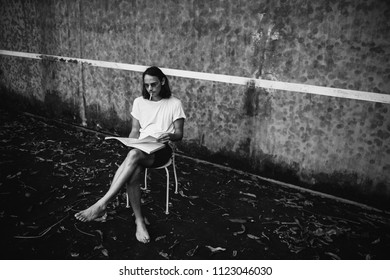 Artsy Man Relaxing At A Tennis Court