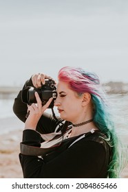 Artsy Woman Taking A Photo At A Beach