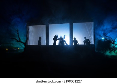 Artwork Decoration. Old House With A Big Windows And Zombies Inside. Blurred Scary Silhouettes At Window. Horror Halloween Concept