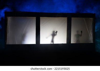 Artwork Decoration. Old House With A Big Windows And Zombies Inside. Blurred Scary Silhouettes At Window. Horror Halloween Concept