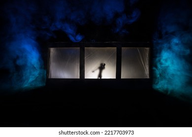 Artwork Decoration. Old House With A Big Windows And Zombies Inside. Blurred Scary Silhouettes At Window. Horror Halloween Concept