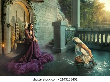 Artwork Fantasy Fairy Evil Insidious Revenge Woman Queen Sits On Throne. Punishes Captive Girl Princess Metal Chains. Shackles On Hands , Mask On Face, Kneels. Backdrop Terrace Medieval Ancient Room