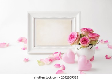 artwork frame mockup, design with pink flowers in vase, white background. This mockup frame is the perfect way to show your artwork. best for mothers day, valentines, birthday or wedding - Shutterstock ID 2042809385