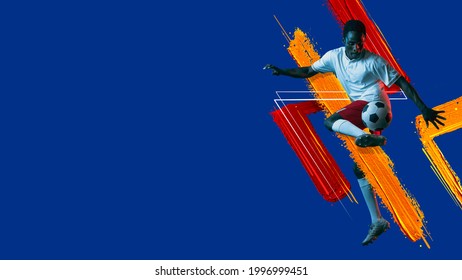 Artwork. Modern Design. Young African Man, Soccer Footbal Player With Ball Training In Neon Light On Blue Background. Watercolor Paints. Concept Of Sport, Game, Action. Copyspace For Ad. Flyer